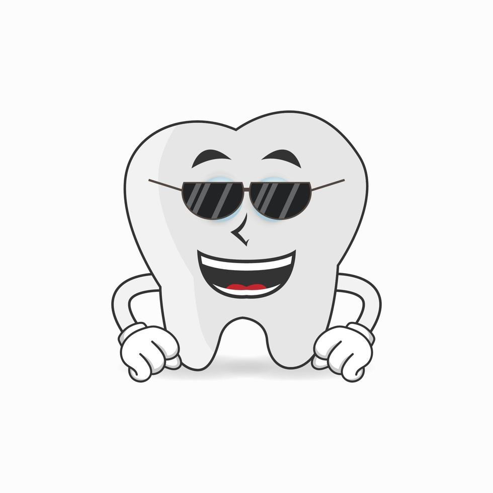 Zahnmaskottchen mit Sonnenbrille. Vektor-Illustration vektor