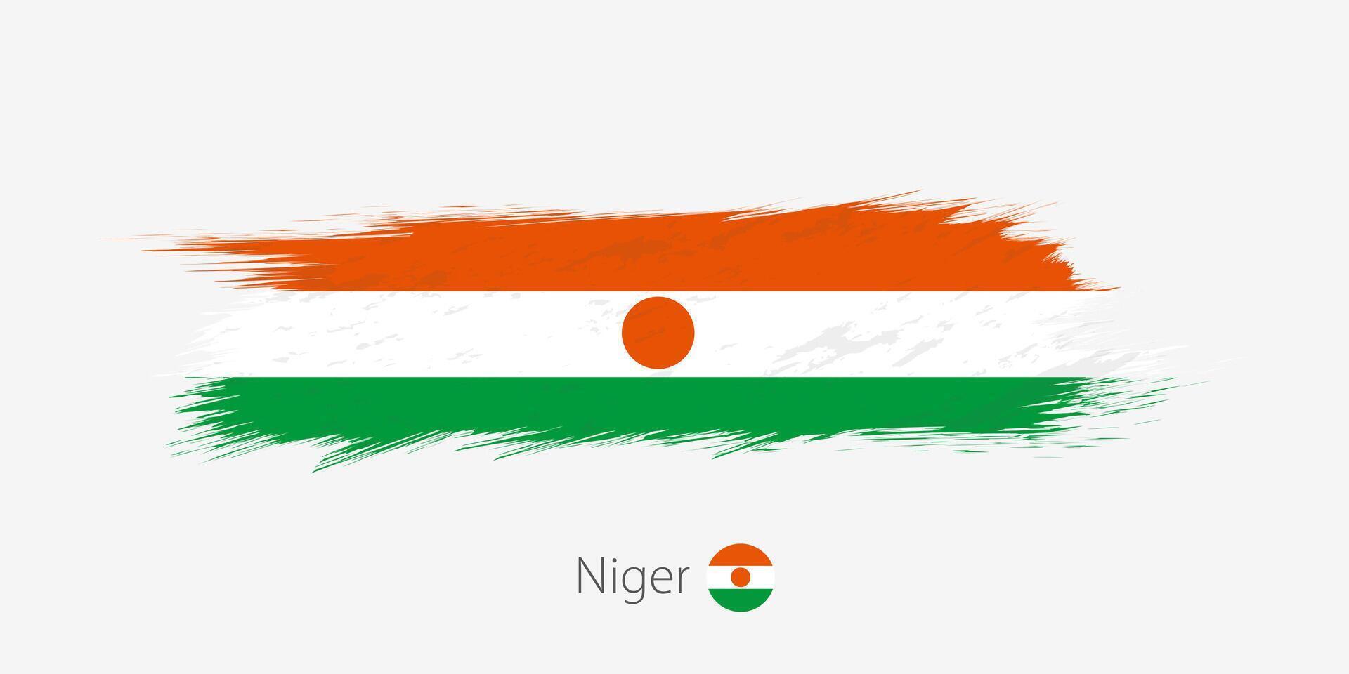 flagga av niger, grunge abstrakt borsta stroke på grå bakgrund. vektor