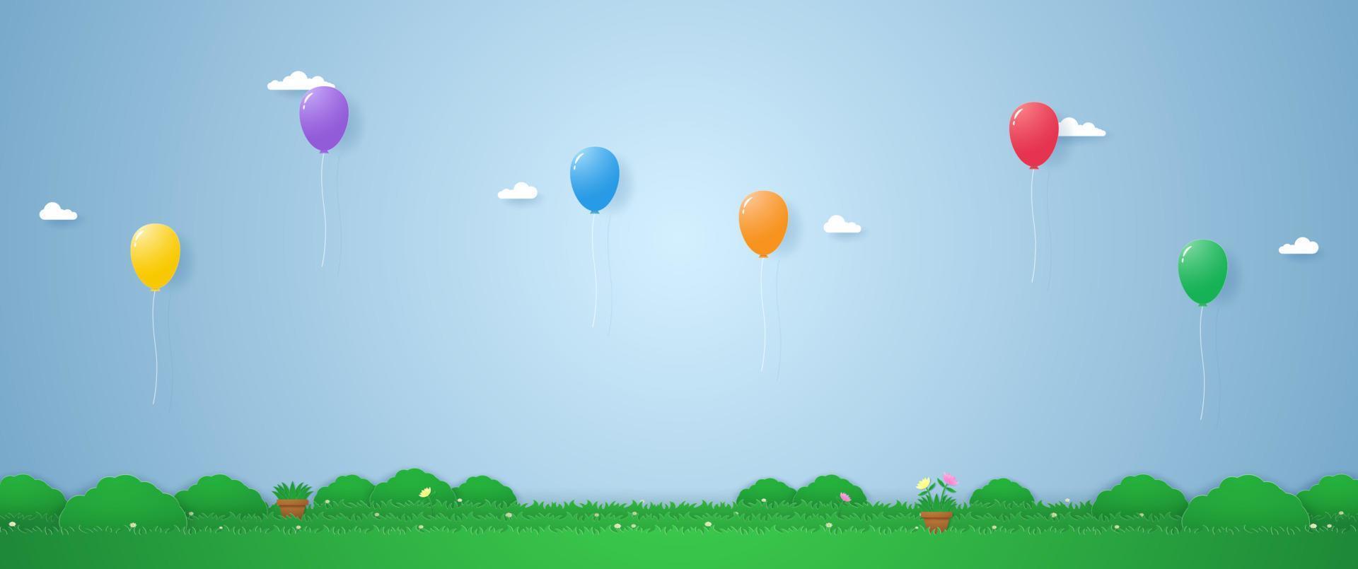 bunte Luftballons, die im Papierkunststil über Gras schweben vektor