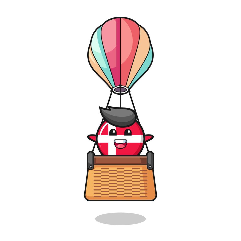 Maskottchen der dänischen Flagge, das einen Heißluftballon reitet vektor
