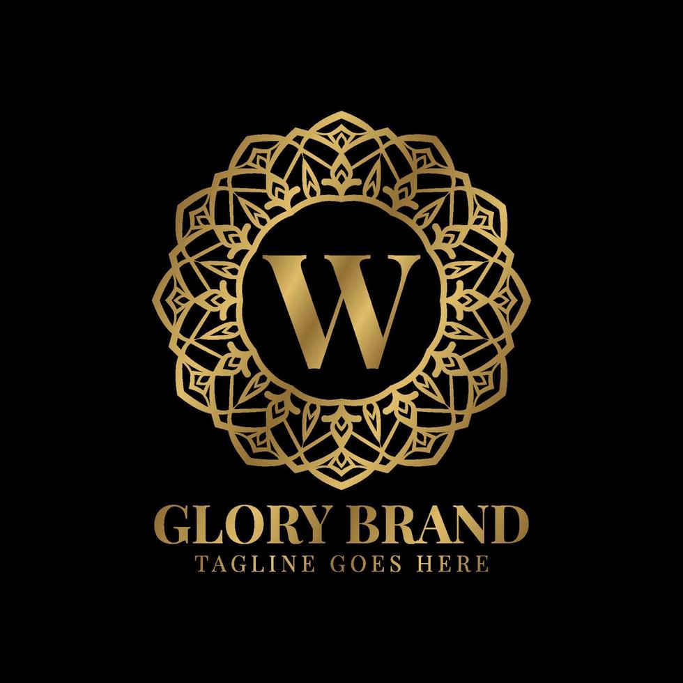 bokstaven w glory mandala vintage gyllene färg lyx vektor logotypdesign