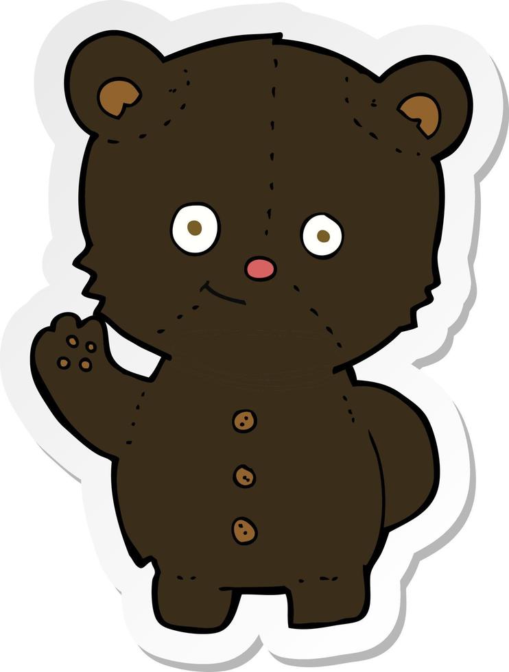 klistermärke av en tecknad vinkande svart björnunge vektor