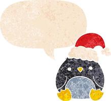 söt tecknad pingvin som bär julhatt och pratbubbla i retro texturerad stil vektor
