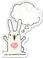 tecknad kanin i kärlek och tankebubbla som ett bedrövat slitet klistermärke vektor