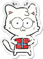 beunruhigter Aufkleber einer Cartoon überraschten Katze mit Weihnachtsgeschenk vektor