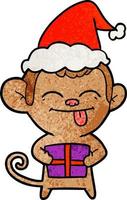 lustiger strukturierter Cartoon eines Affen mit Weihnachtsgeschenk mit Weihnachtsmütze vektor