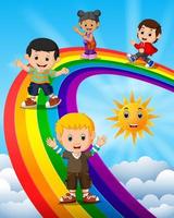 glückliche Kinder, die über dem Regenbogen stehen vektor