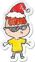 Distressed Sticker Cartoon eines Jungen mit Sonnenbrille und Weihnachtsmütze vektor