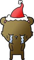 weinender Gradienten-Cartoon eines Bären mit Weihnachtsmütze vektor