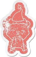 Happy Cartoon Distressed Aufkleber eines Eisbären mit Weihnachtsmütze vektor