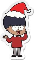 Fröhlicher Aufkleber-Cartoon eines Jungen mit Weihnachtsmütze vektor