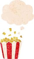 tecknad popcorn och tankebubbla i retro texturerad stil vektor