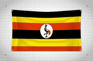 uganda flagga hängande på tegelvägg. 3d ritning. flagga fäst på väggen. rita snyggt i grupper på separata lager för enkel redigering. vektor