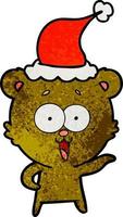lachender teddybär texturierte karikatur einer tragenden weihnachtsmütze vektor