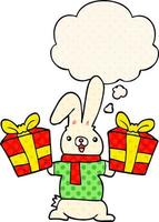 tecknad kanin med julklappar och tankebubbla i serietidningsstil vektor