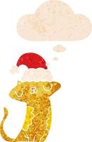 söt tecknad serie katt bär jul hatt och trodde bubbla i retro texturerad stil vektor