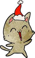Fröhlicher strukturierter Cartoon einer Katze mit Weihnachtsmütze vektor