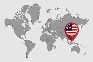 nåla karta med malaysiska flaggan på världskartan. vektor illustration.