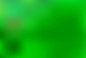 ljusgrön vektor suddig och färgad bakgrund.