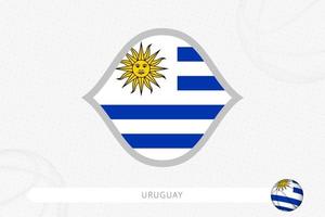 uruguay-flagge für basketballwettbewerb auf grauem basketballhintergrund. vektor