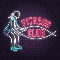 neon fitness club tecken på tegelvägg bakgrund. vektor illustration.