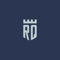 rq-logo-monogramm mit festungsschloss und schildstildesign vektor