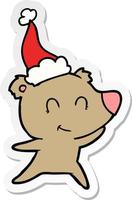 weibliche Bärenaufkleberkarikatur einer tragenden Weihnachtsmannmütze vektor