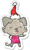bedrövad klistermärke tecknad av en hund som sticker ut tungan bär tomte hatt vektor