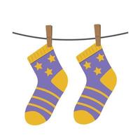 Farbige Kindersocken, die an einem Seil hängen, vektorisolierte Illustration vektor