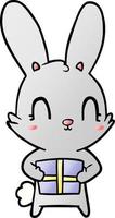 süßes Cartoon-Kaninchen mit Geschenk vektor