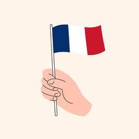 karikaturhand, die französische flagge hält. flagge von frankreich, konzeptillustration, flaches design lokalisierter vektor. vektor