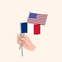 karikaturhand, die vereinigte staaten und französische flaggen hält. uns frankreich beziehungen. Konzept der Diplomatie, Politik und demokratischen Verhandlungen. flaches Design isolierter Vektor
