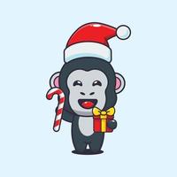 söt gorilla innehav jul godis och gåva. söt jul tecknad serie illustration. vektor
