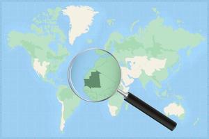 Karta av de värld med en förstorande glas på en Karta av mauretanien. vektor