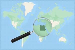 Karta av de värld med en förstorande glas på en Karta av egypten. vektor