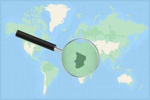 Weltkarte mit einer Lupe auf einer Karte des Tschad. vektor