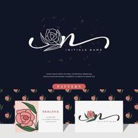 handschrift buchstabe n logo design mit rose vektor