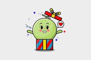 niedliche Cartoon-Melone, die aus einer großen Geschenkbox herauskommt vektor