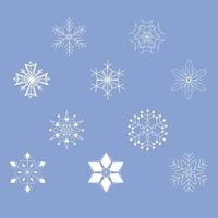 Satz von zehn verschiedenen Schneeflocken auf blauem Hintergrund.