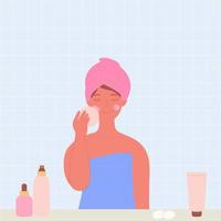 eine frau wäscht ihr gesicht mit kosmetik im badezimmer. eine Frau mit einem Handtuch auf dem Kopf. vektor