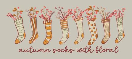 bequeme herbstsocken mit floralem hintergrund für die dekoration handgezeichnete vektorillustration vektor