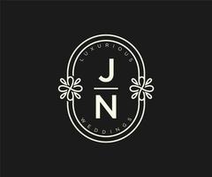 jn initialen brief hochzeitsmonogramm logos vorlage, handgezeichnete moderne minimalistische und florale vorlagen für einladungskarten, datum speichern, elegante identität. vektor