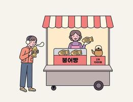 koreanisches Streetfood. Taiyaki Shop und Kunden. vektor