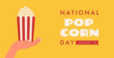 banner für webdesign und grafikdesign für den nationalen popcorntag am 19. januar mit einer hand, die eine schachtel mit rot-weiß gestreiftem popcorn hält. vektor
