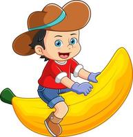 ein Bauernjunge, der glücklich spielt und auf einer großen Banane sitzt vektor