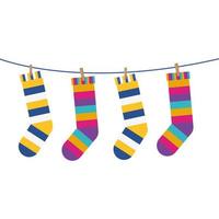Socken mit farbigen Streifen hängen an der Linie vektor