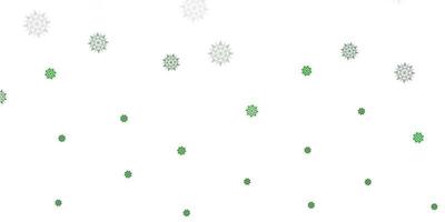 hellgrünes Vektorlayout mit schönen Schneeflocken. vektor