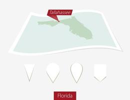 gebogen Papier Karte von Florida Zustand mit Hauptstadt Tallahassee auf grau Hintergrund. vier anders Karte Stift Satz. vektor