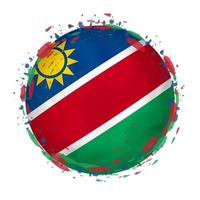 runden Grunge Flagge von Namibia mit spritzt im Flagge Farbe. vektor