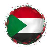 runden Grunge Flagge von Sudan mit spritzt im Flagge Farbe. vektor
